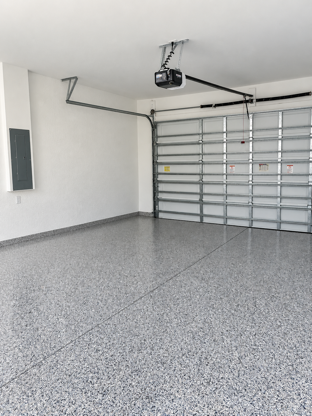 Professionally finished Florida garage with gray flake flooring